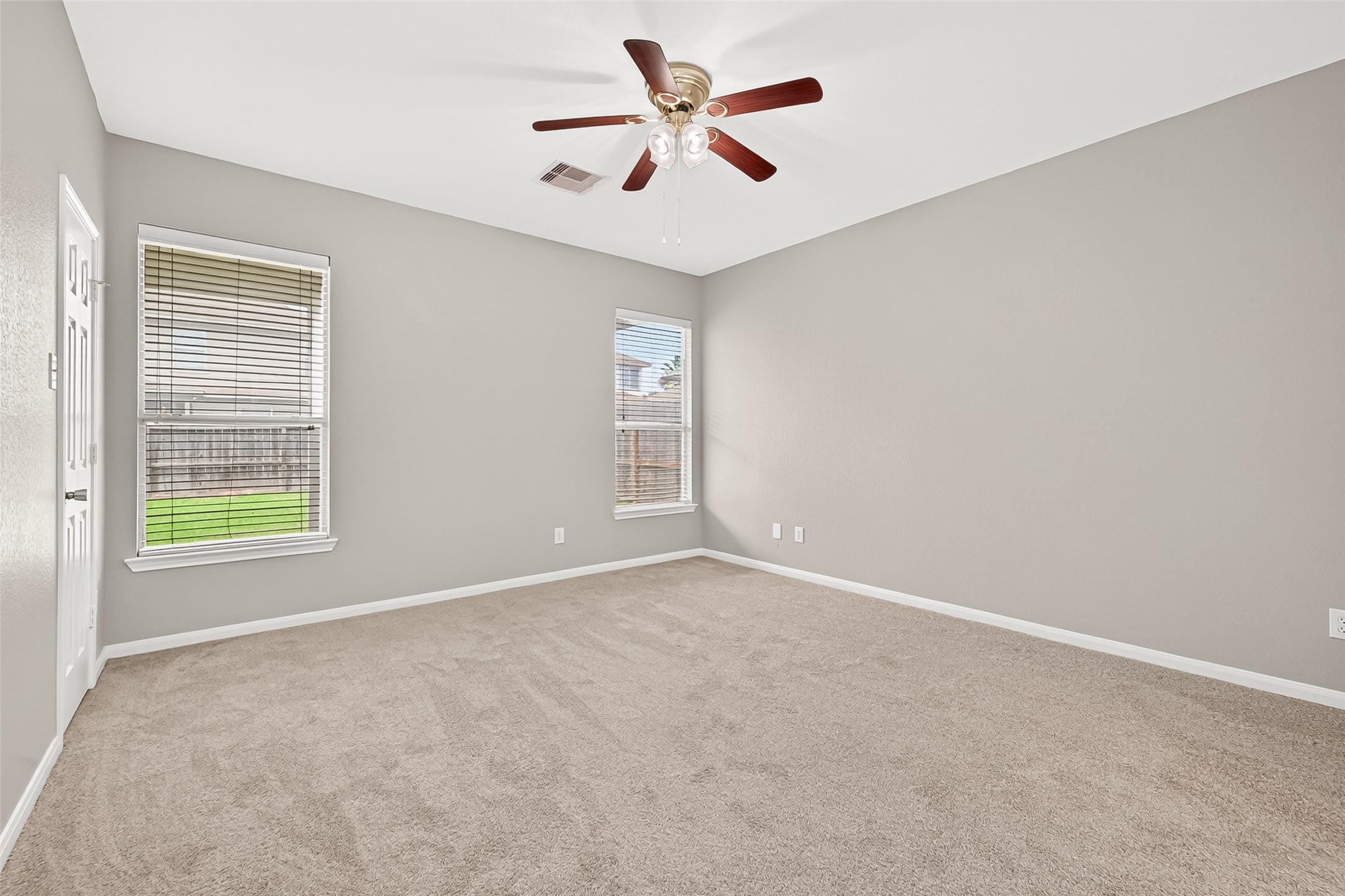 21327 Bella Flora Court Spring, TX 77379 - Photo 19 of 50 an empty room with windows and fan