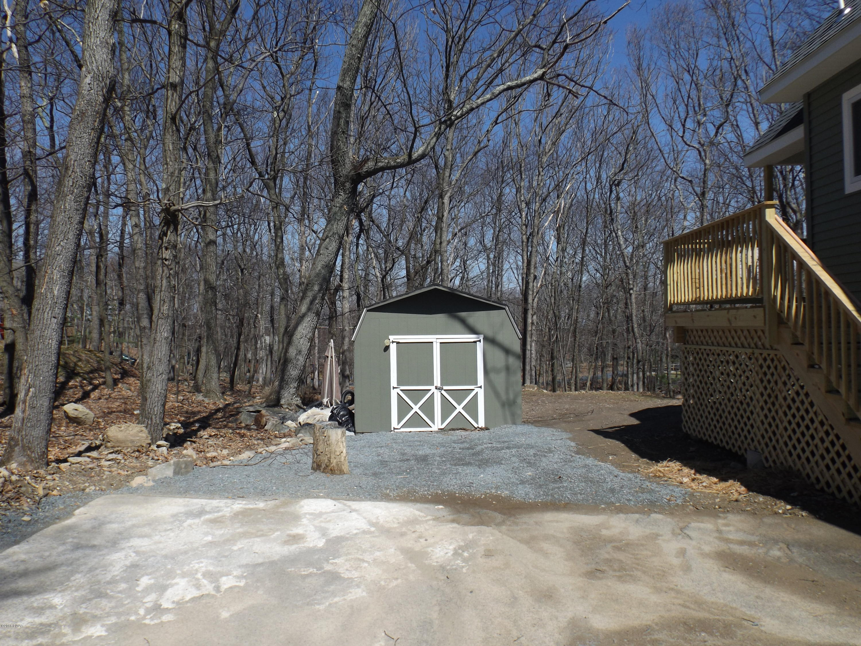 109 Keystone Court Dingmans Ferry, PA 18328 - Photo 18 of 18 a front view of a house with a yard