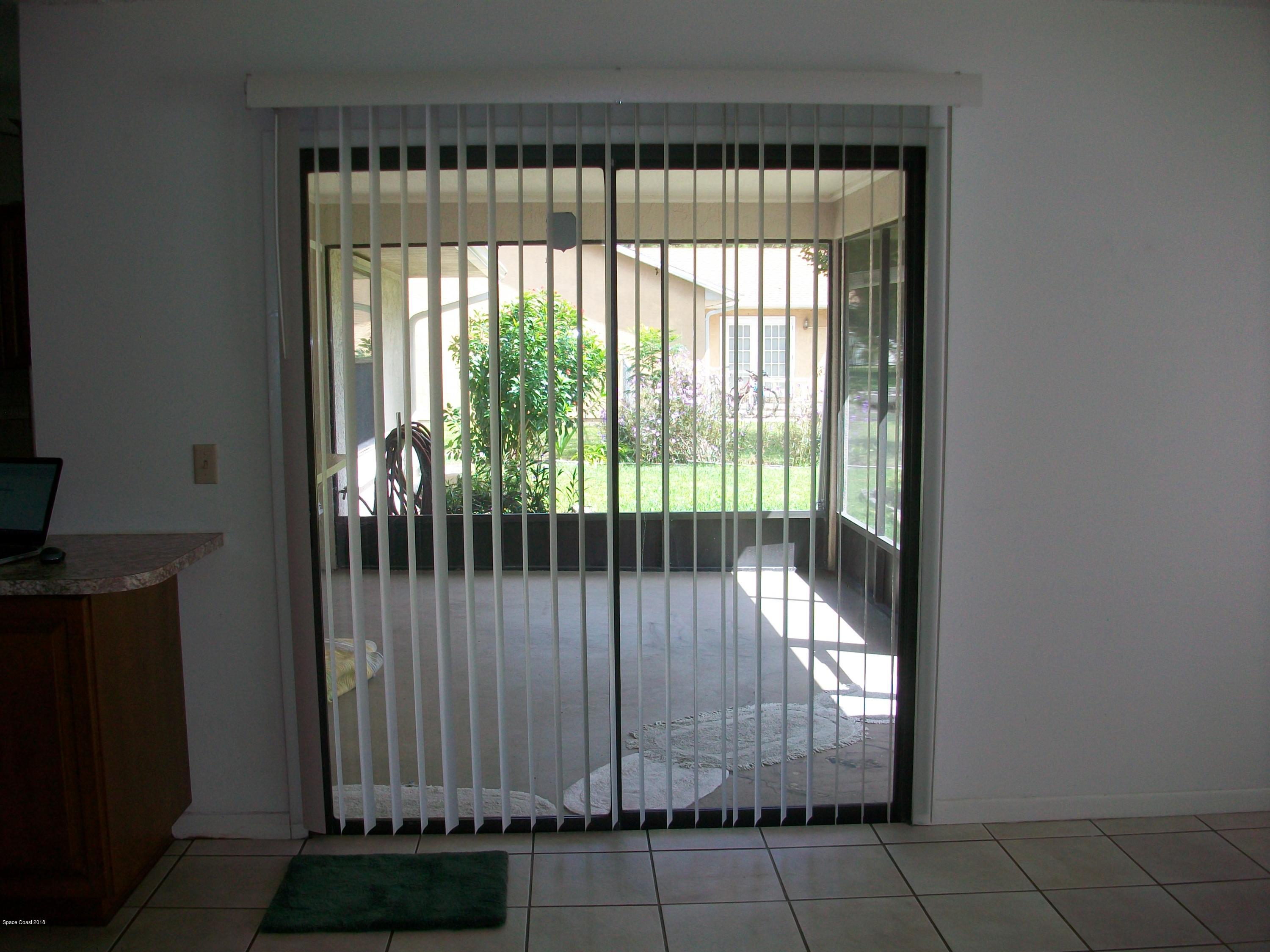 240 Rheine Road Northwest Palm Bay, FL 32907 - Photo 5 of 30 FAMILY ROOM SLIDER