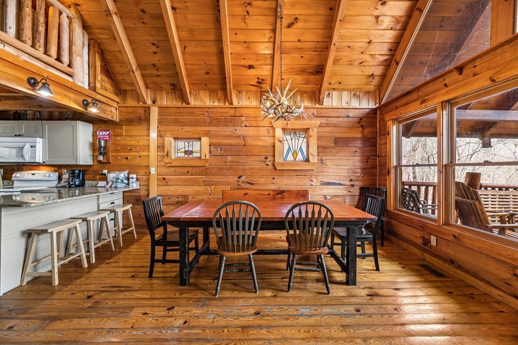 4130 Evans Chapel Road Sevierville, TN 37876 - Photo 9 of 33 a view of a dining room with furniture window and wooden floor