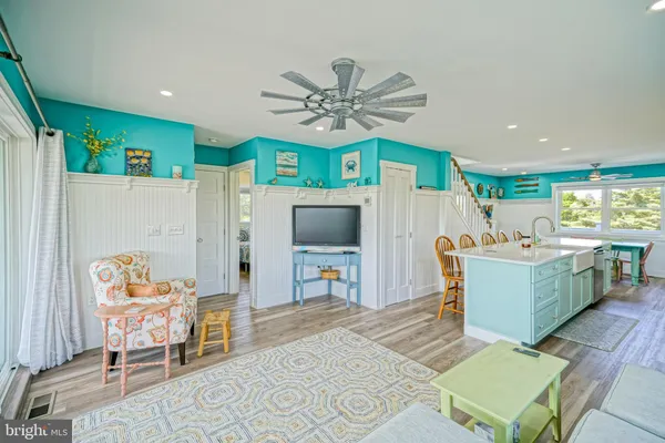 a view of living room with furniture and a rug
