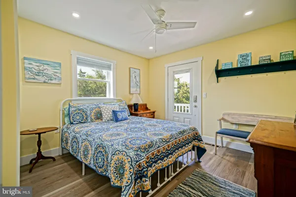 a view of a two chairs and table in the balcony