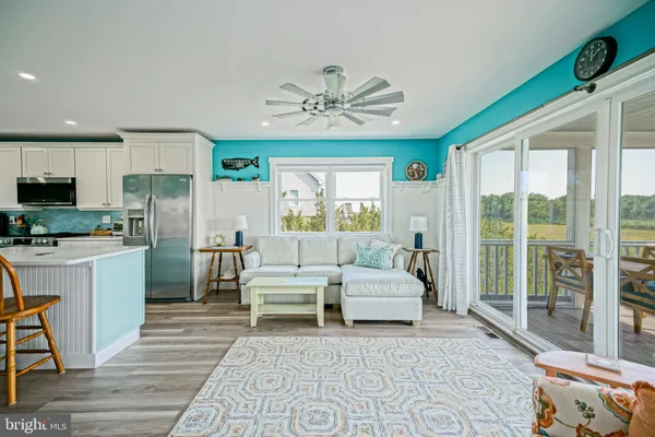 a bathroom with a granite countertop sink a mirror and a shower