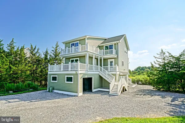 a view of a chair and table in the balcony