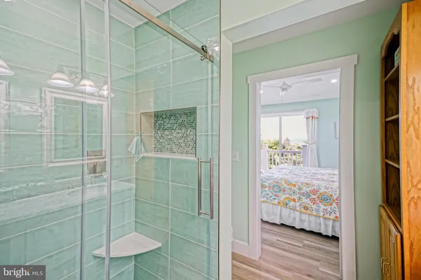 a aerial view of a house with a big yard and large trees