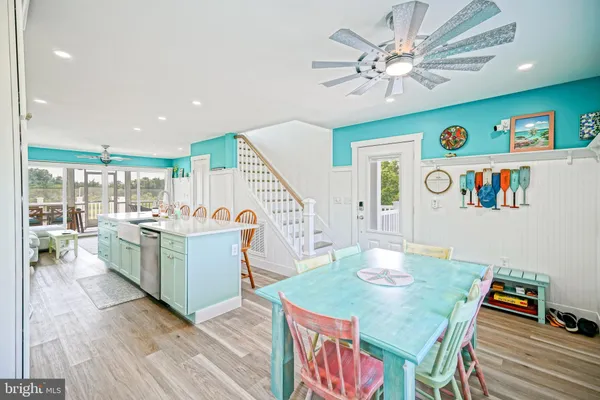 a kitchen with white cabinets and appliances
