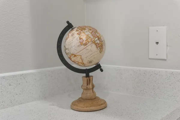 a room with water heater and wooden floors