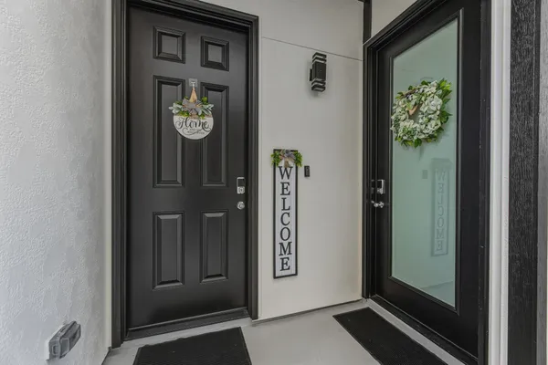 a view of an entryway with a hallway