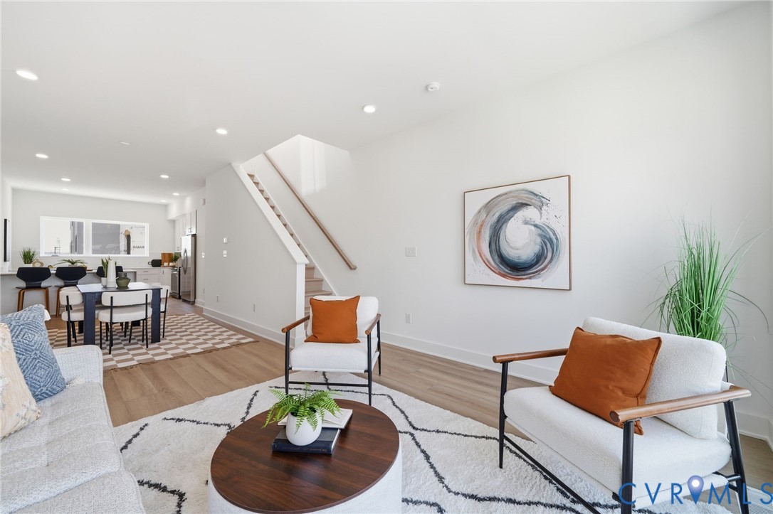 112 Manchester Road Richmond, VA 23224 - Photo 10 of 21 Open-concept living area featuring wood-finish flo