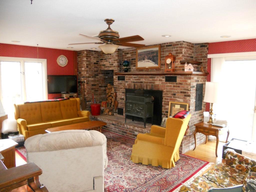 32 Sturtevant Pond Road Errol, NH 03579 - Photo 5 of 19 Living room with wood stove