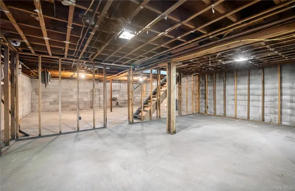 a view of an empty room with wooden walls