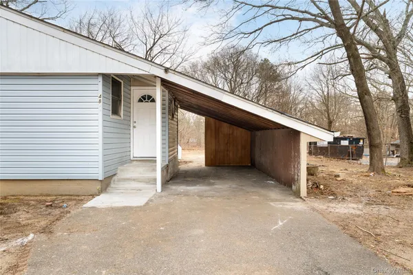 a view of a house with a snow in the yard