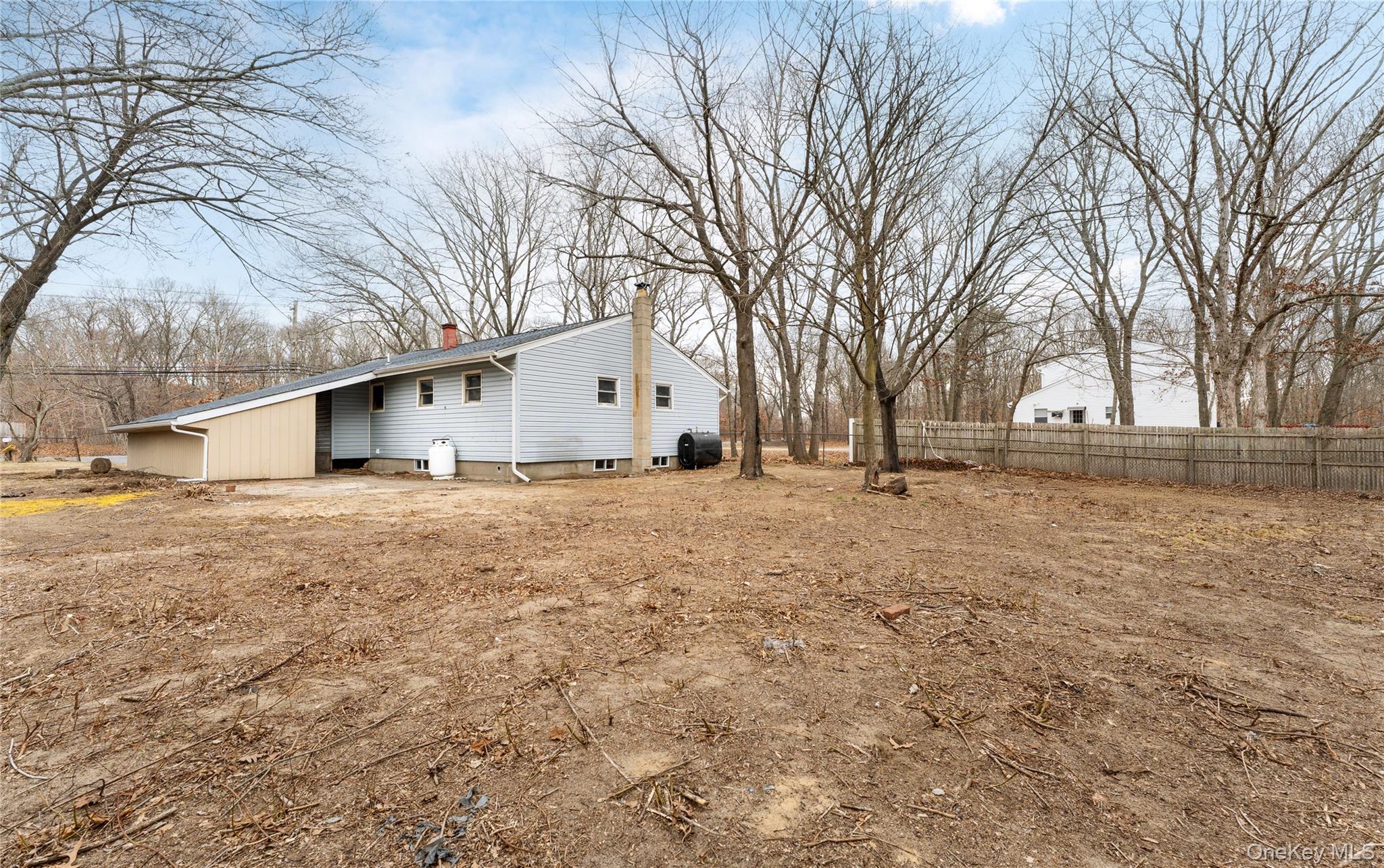 48 Hawkins Road Centereach, NY 11720 - Photo 19 of 22 a view of large yard with large trees