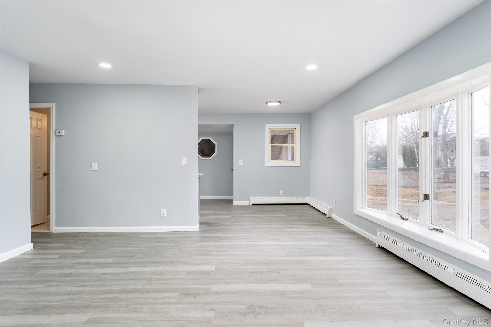48 Hawkins Road Centereach, NY 11720 - Photo 3 of 22 a view of an empty room with a window