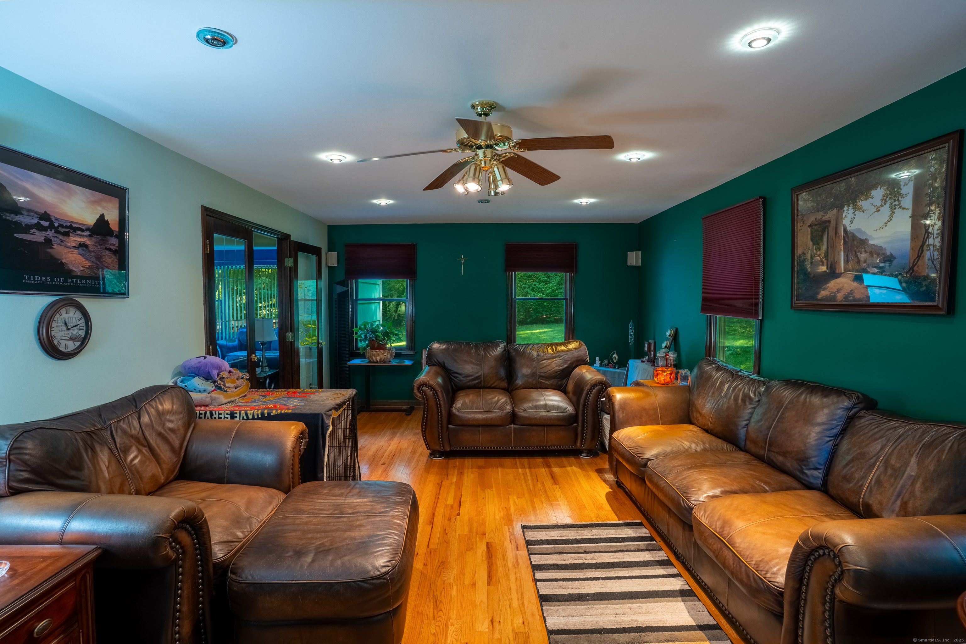 124 Bagburn Hill Road Monroe, CT 06468 - Photo 11 of 34 a living room with furniture and a flat screen tv
