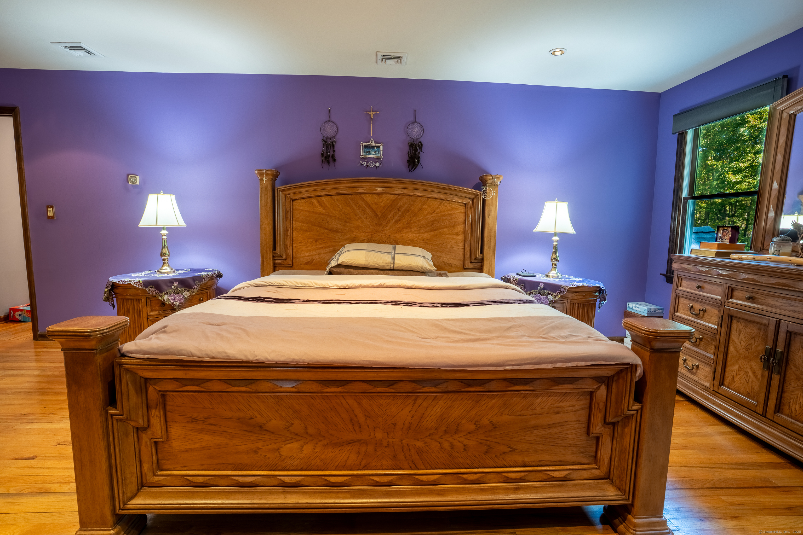 124 Bagburn Hill Road Monroe, CT 06468 - Photo 16 of 34 a bedroom with a bed and a potted plant