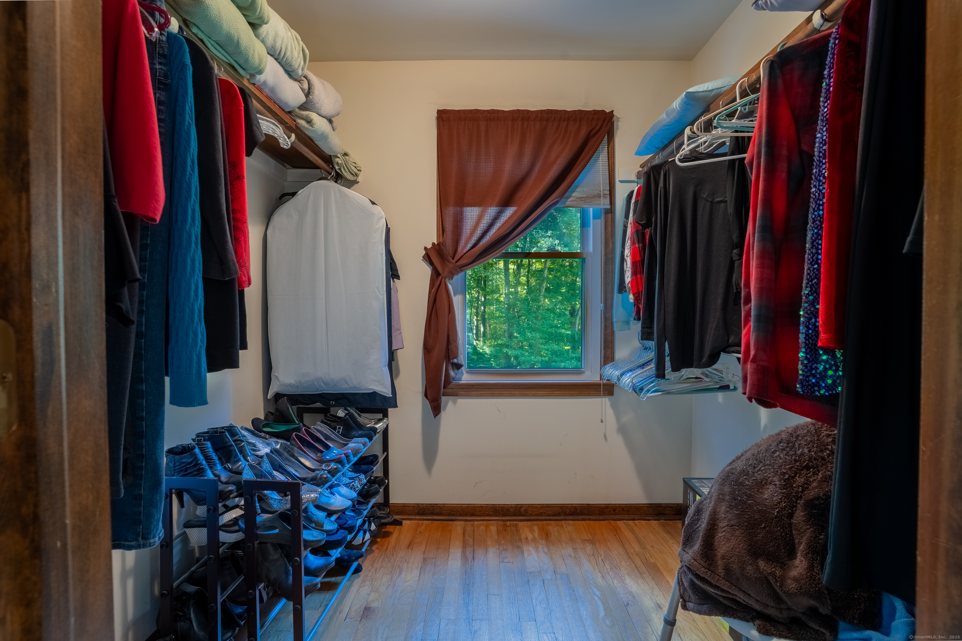 124 Bagburn Hill Road Monroe, CT 06468 - Photo 19 of 34 a view of walk in closet with clothes and shoes