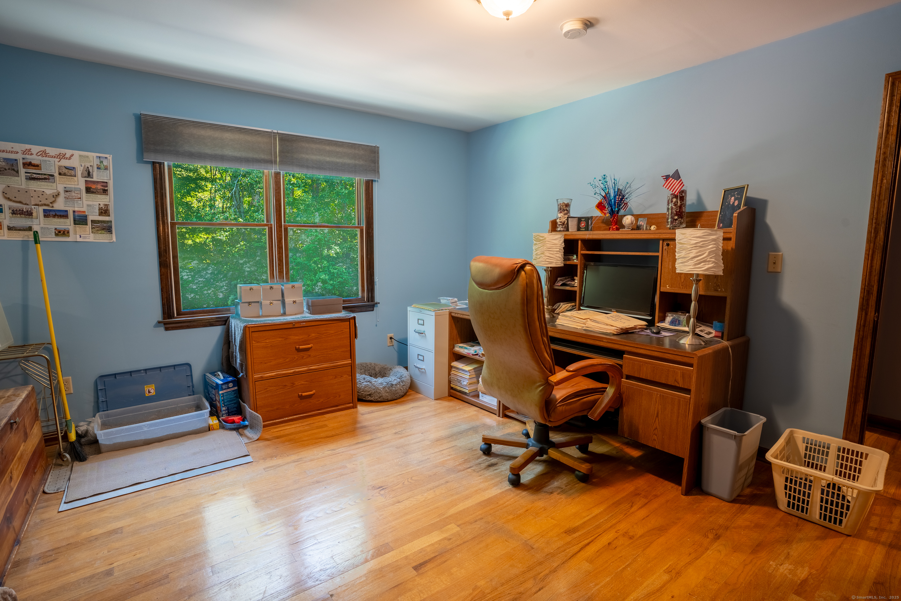 124 Bagburn Hill Road Monroe, CT 06468 - Photo 22 of 34 a view of a workspace with furniture and a window