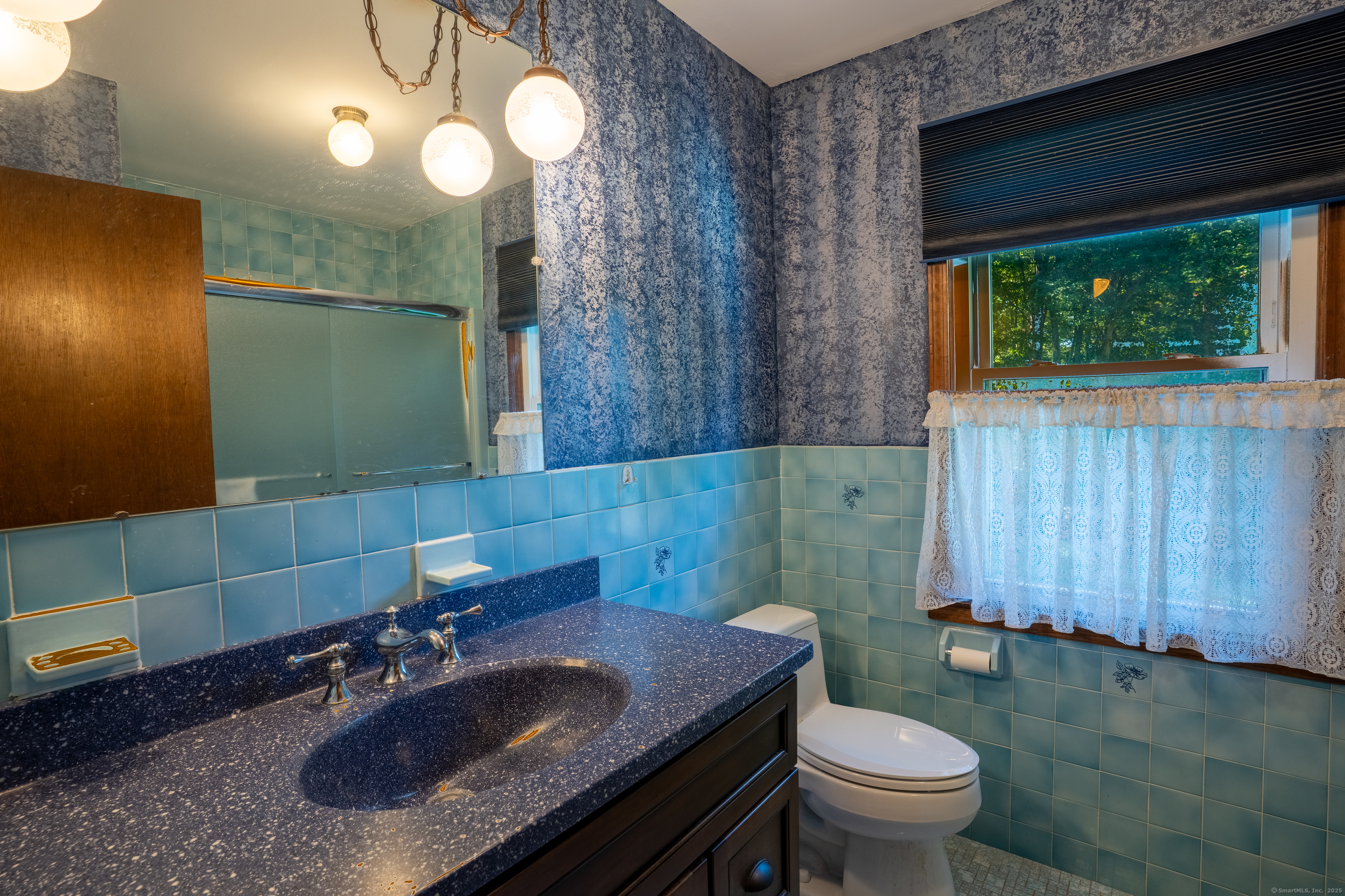 124 Bagburn Hill Road Monroe, CT 06468 - Photo 24 of 34 a bathroom with a sink a toilet and mirror