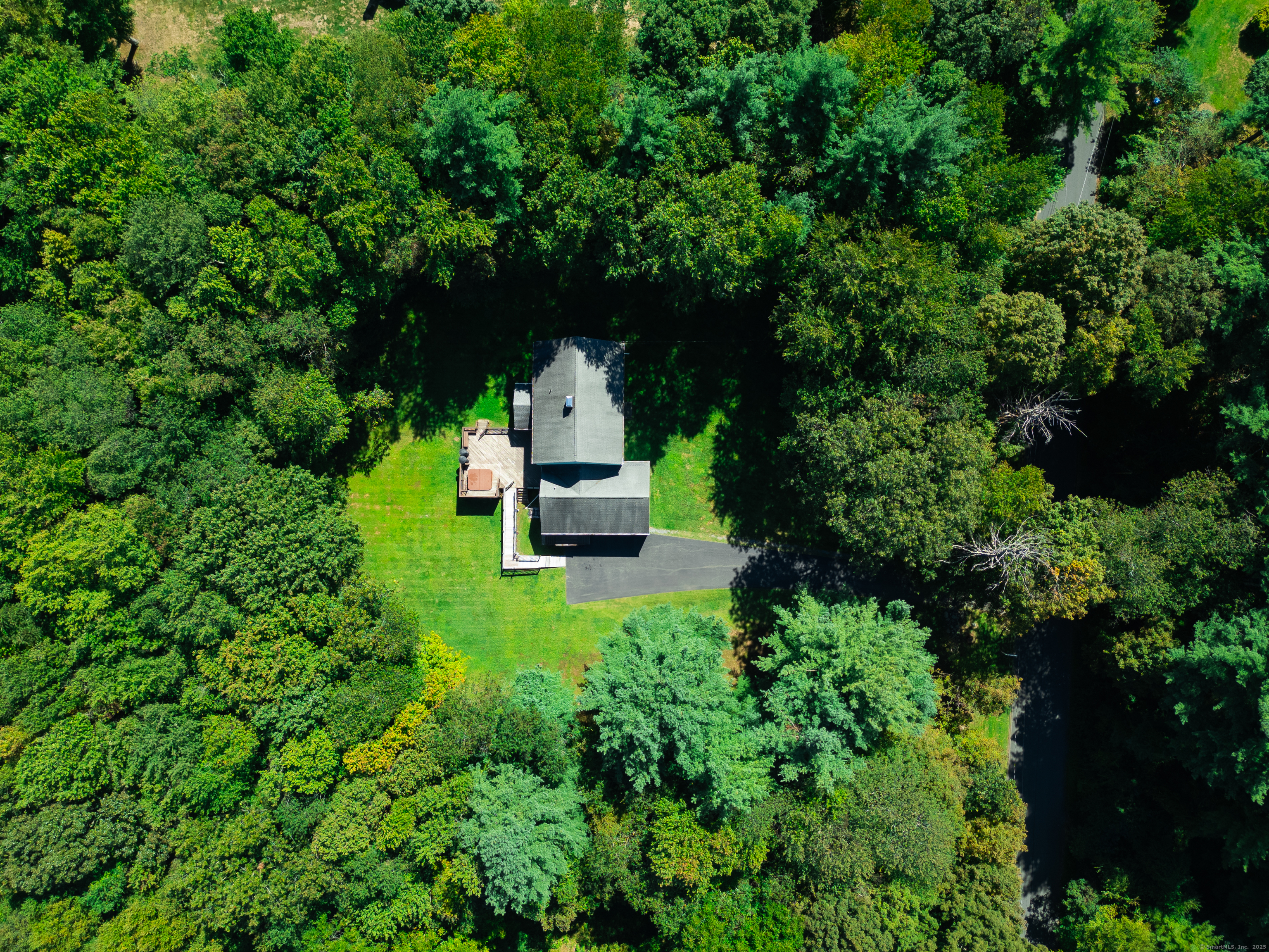 124 Bagburn Hill Road Monroe, CT 06468 - Photo 33 of 34 a view of a tiny house with a small yard and large trees