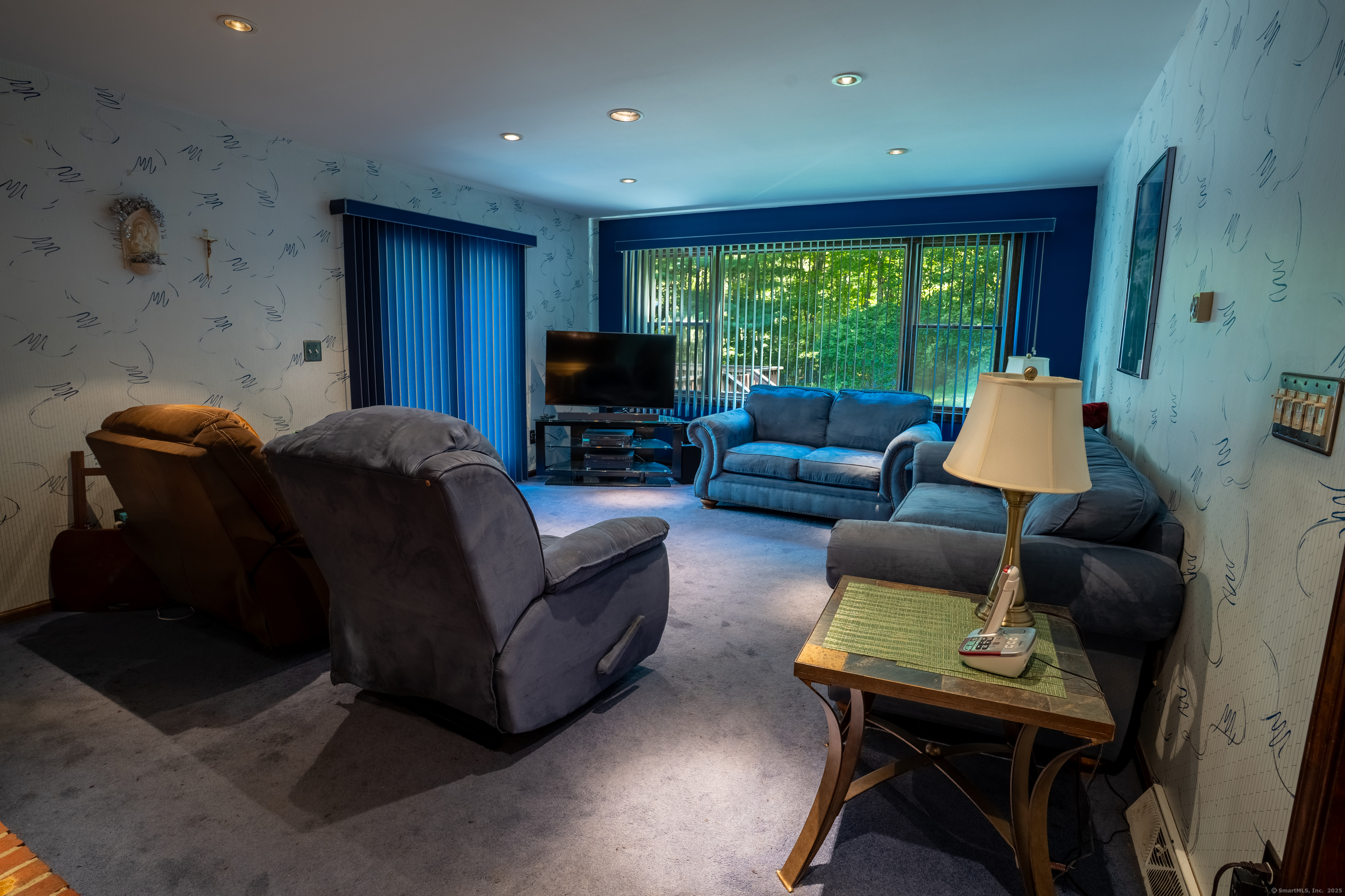 124 Bagburn Hill Road Monroe, CT 06468 - Photo 8 of 34 a living room with furniture and a flat screen tv