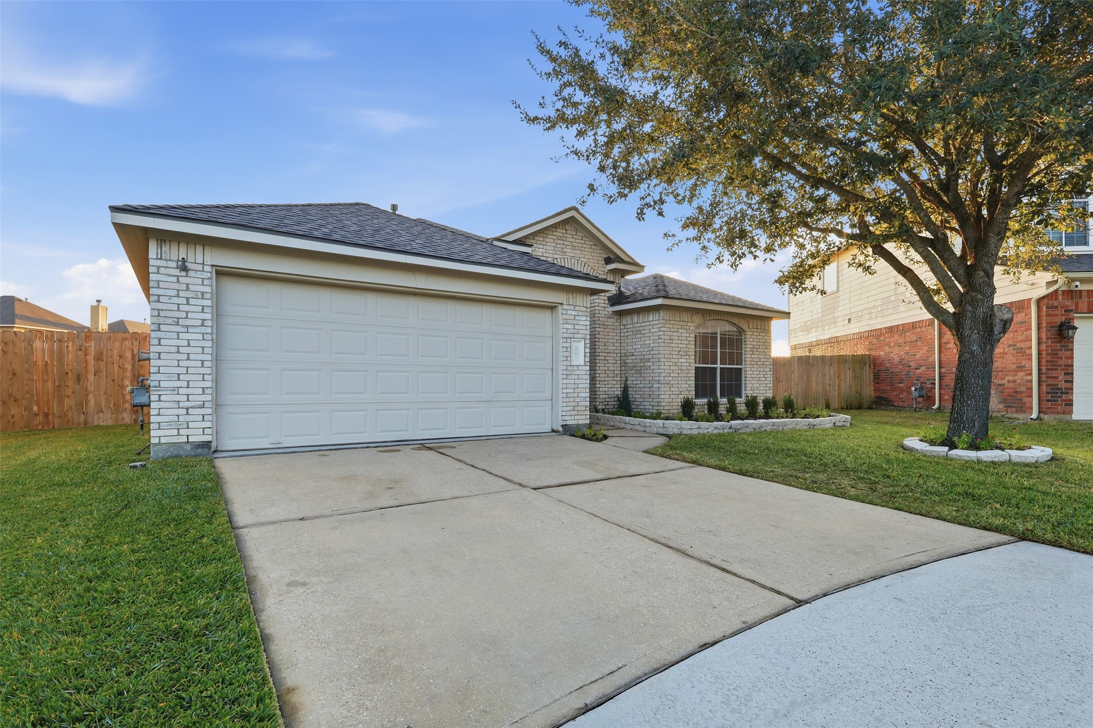 6006 Wilcox Point Drive Spring, TX 77388 - Photo 3 of 30 front view of house with a yard and trees all around
