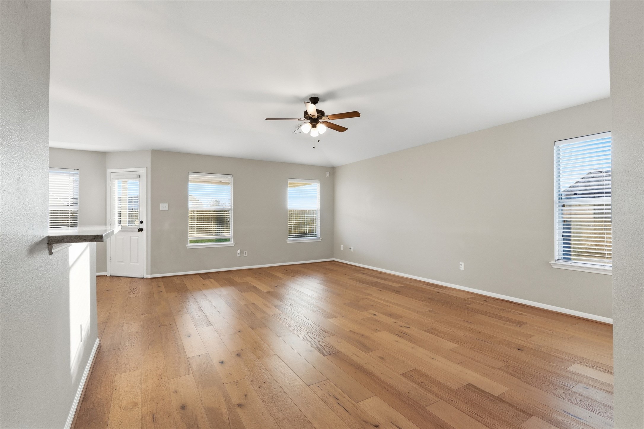 6006 Wilcox Point Drive Spring, TX 77388 - Photo 10 of 30 an empty room with wooden floor and windows