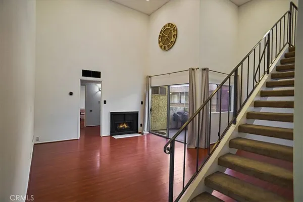 a view of an entryway with wooden floor