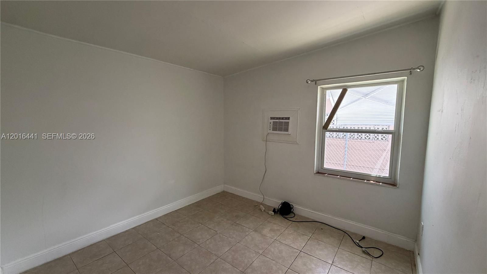 2230 Service Road Opa-Locka, FL 33054 - Photo 12 of 25 an empty room with a window