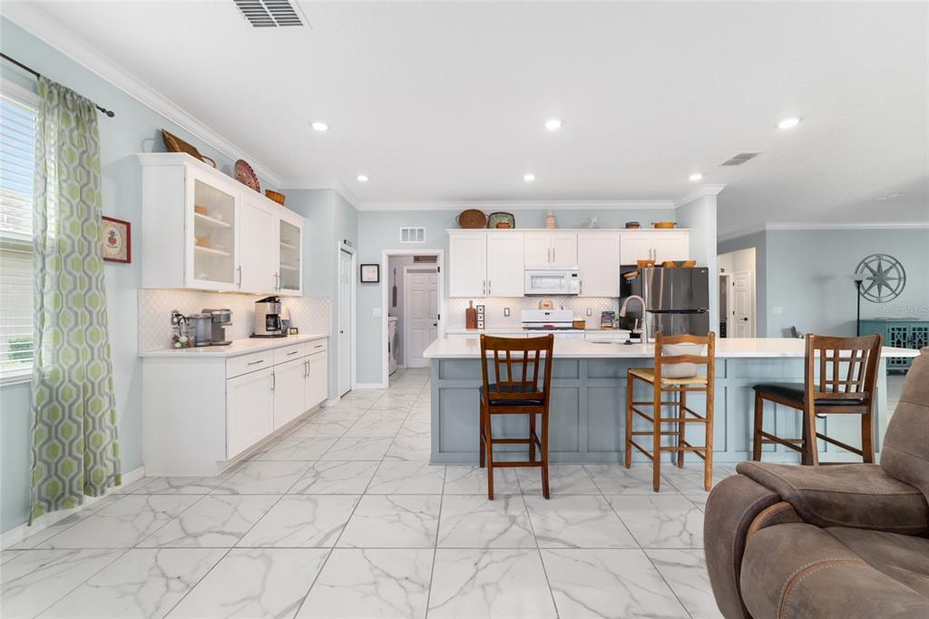 7765 Southwest 80th Pl Road Ocala, FL 34476 - Photo 16 of 37 a kitchen with appliances and cabinets