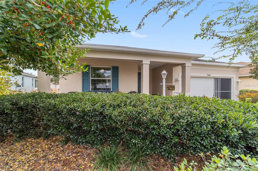 7765 Southwest 80th Pl Road Ocala, FL 34476 - Photo 2 of 37 front view of a house with a small yard