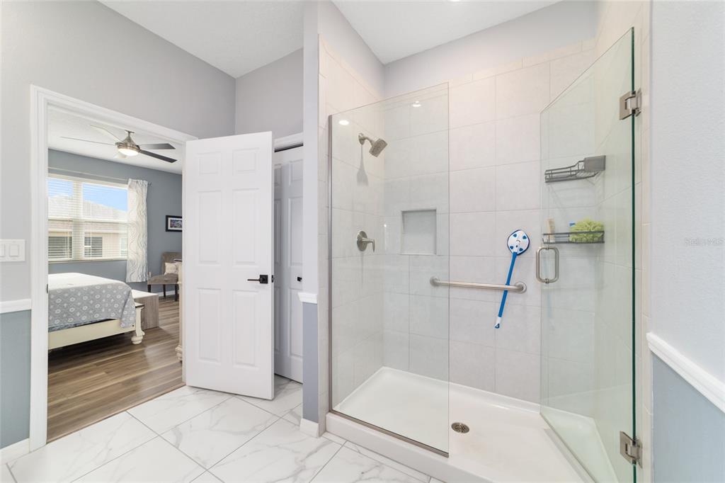 7765 Southwest 80th Pl Road Ocala, FL 34476 - Photo 27 of 37 a bathroom with a shower