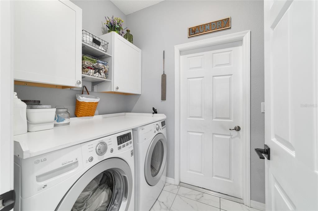 7765 Southwest 80th Pl Road Ocala, FL 34476 - Photo 32 of 37 a utility room with dryer and washer