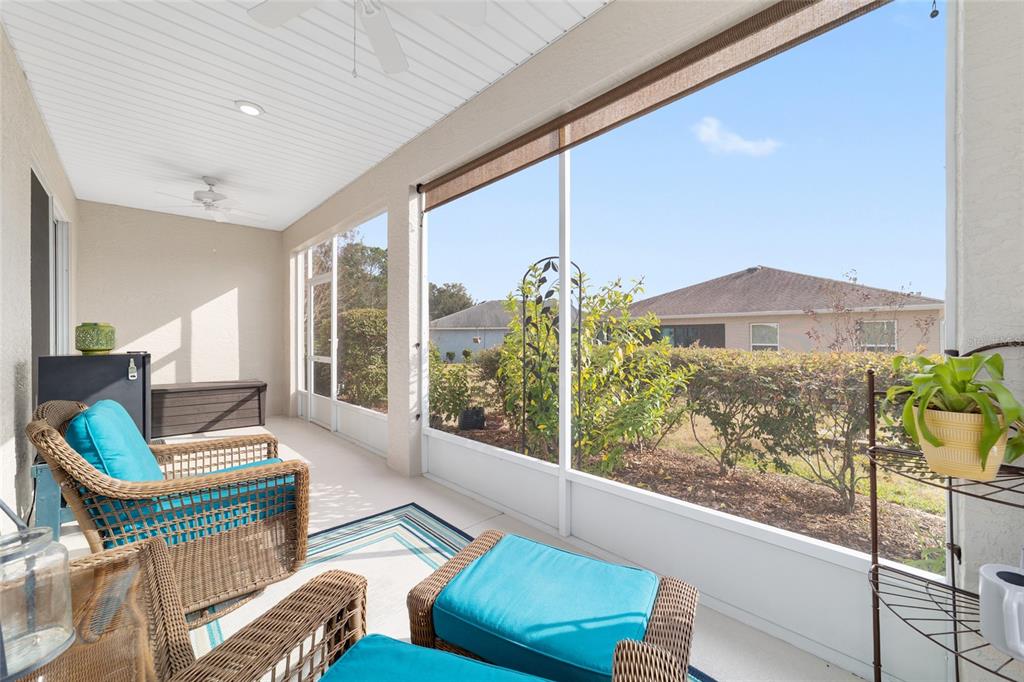 7765 Southwest 80th Pl Road Ocala, FL 34476 - Photo 34 of 37 a living room with furniture and a large window
