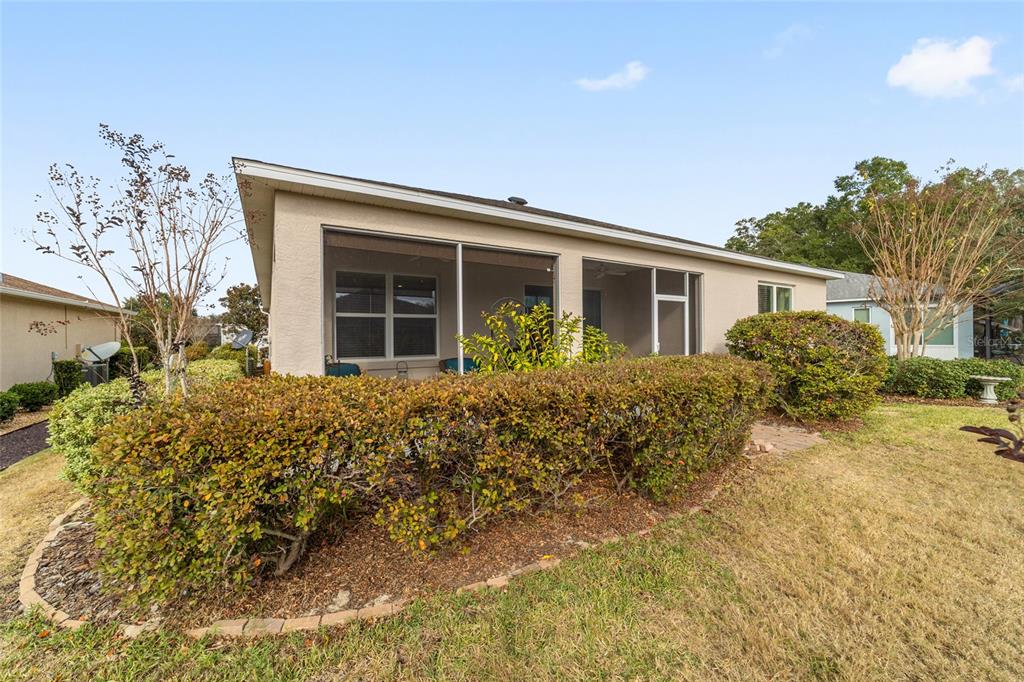 7765 Southwest 80th Pl Road Ocala, FL 34476 - Photo 35 of 37 front view of a house with a yard