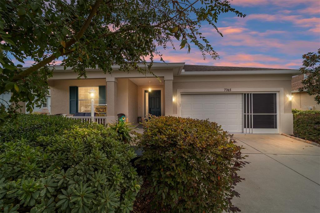 7765 Southwest 80th Pl Road Ocala, FL 34476 - Photo 4 of 37 front view of a house with a yard