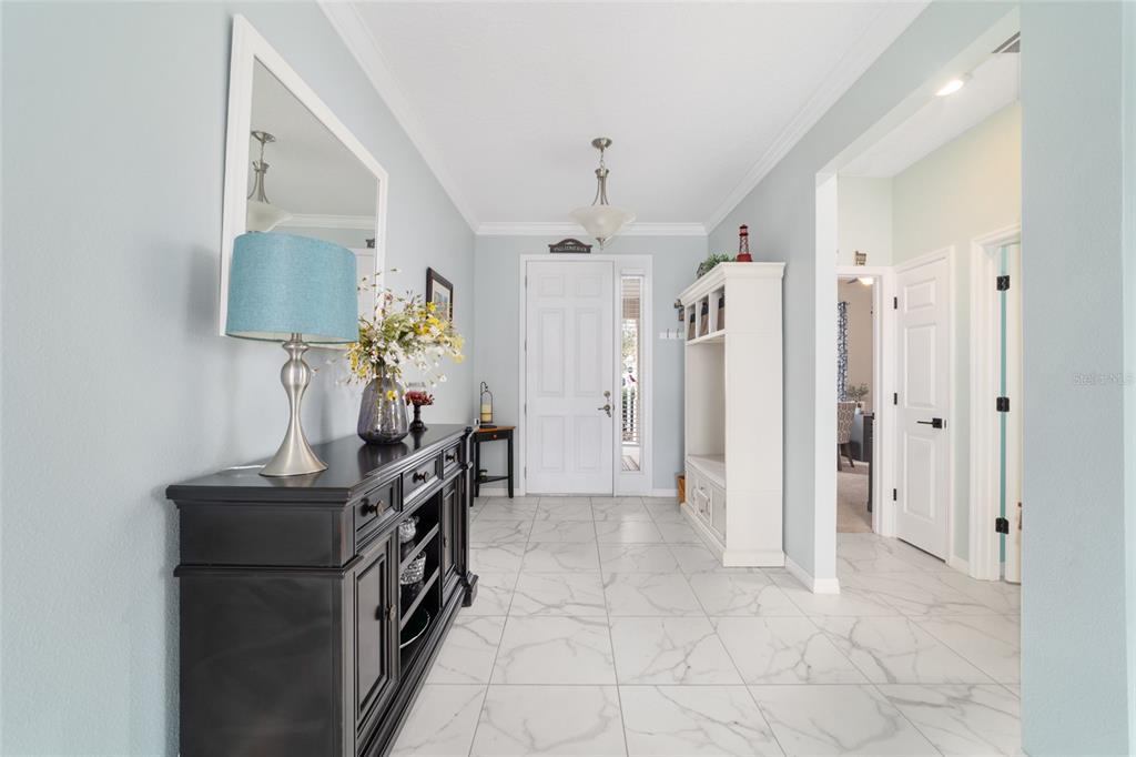 7765 Southwest 80th Pl Road Ocala, FL 34476 - Photo 6 of 37 a view of kitchen with stainless steel appliances granite countertop a refrigerator and a sink