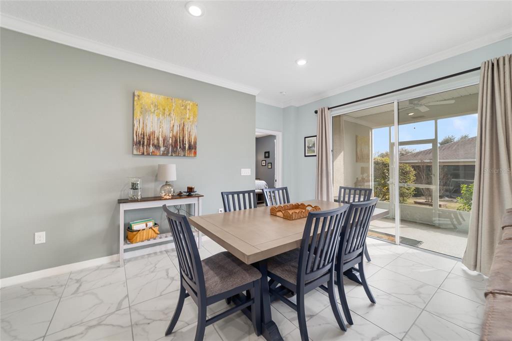 7765 Southwest 80th Pl Road Ocala, FL 34476 - Photo 10 of 37 a view of a dining room with furniture window and outside view