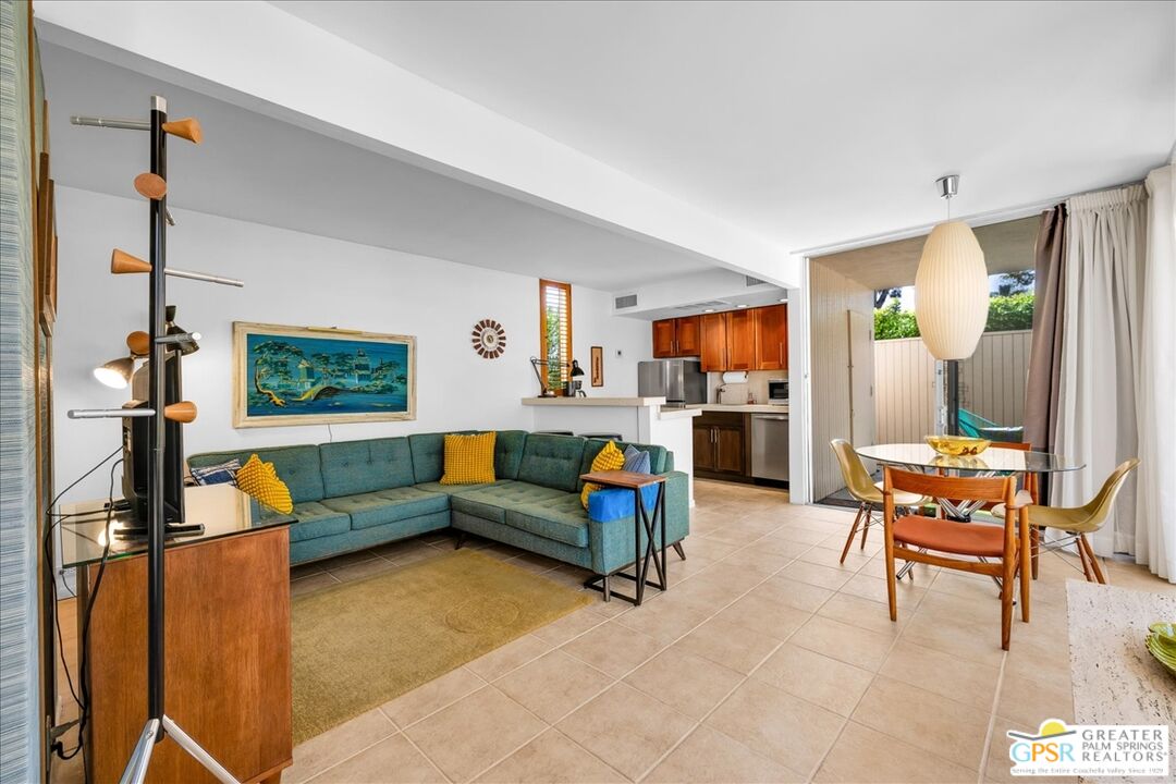 360 Cabrillo Road, Unit 220 Palm Springs, CA 92262 - Photo 11 of 57 a living room with furniture and a flat screen tv