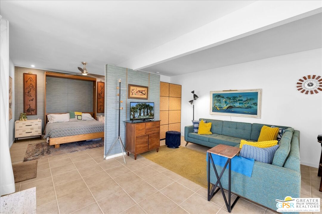 360 Cabrillo Road, Unit 220 Palm Springs, CA 92262 - Photo 16 of 57 a bedroom with furniture and a couch