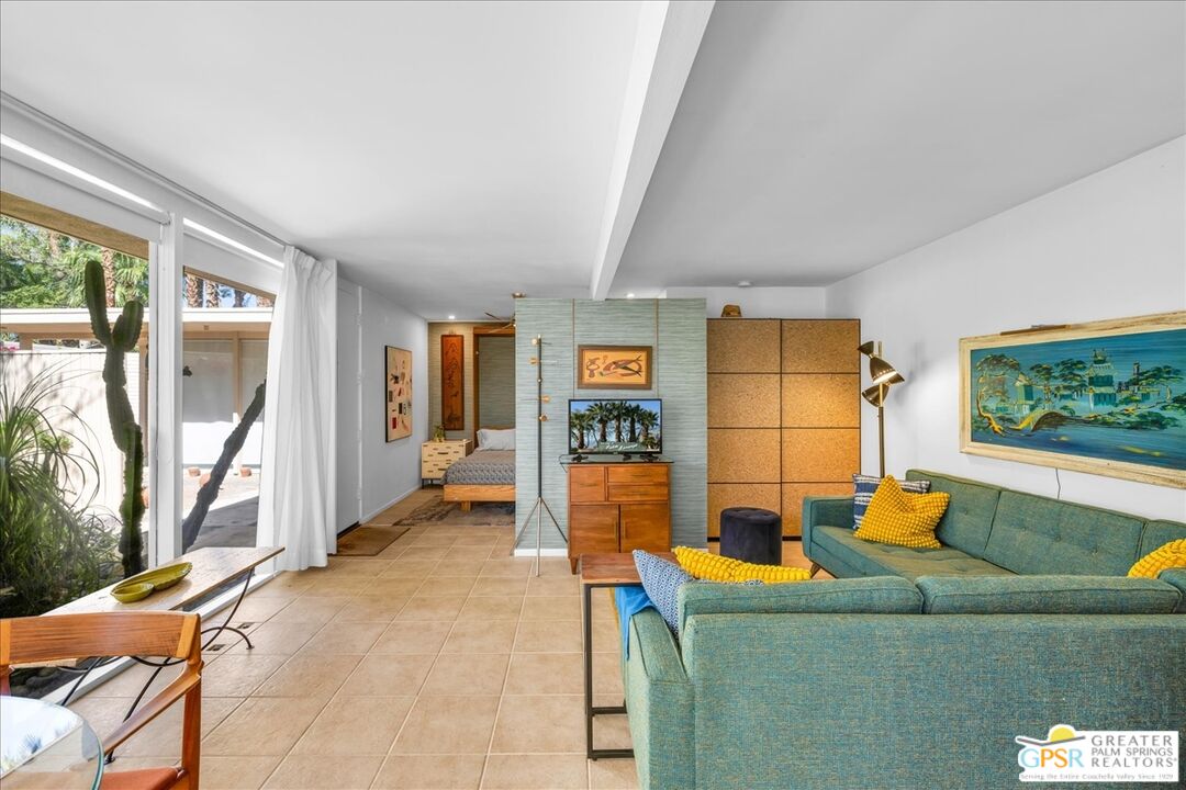 360 Cabrillo Road, Unit 220 Palm Springs, CA 92262 - Photo 17 of 57 a living room with furniture and a flat screen tv