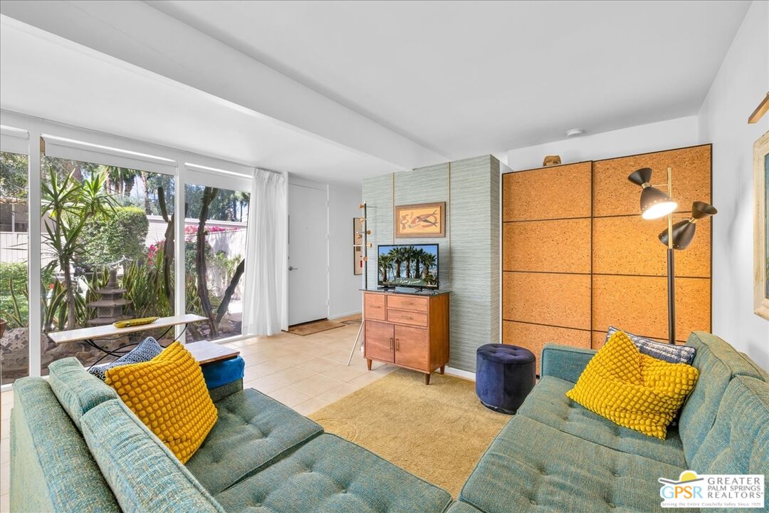 360 Cabrillo Road, Unit 220 Palm Springs, CA 92262 - Photo 18 of 57 a living room with furniture and a large window