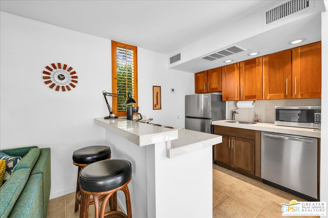 360 Cabrillo Road, Unit 220 Palm Springs, CA 92262 - Photo 20 of 57 a kitchen with a sink cabinets and window