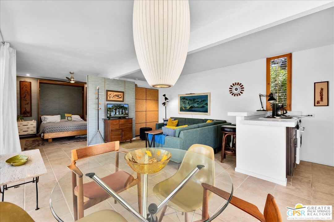 360 Cabrillo Road, Unit 220 Palm Springs, CA 92262 - Photo 23 of 57 a living room with furniture and a flat screen tv