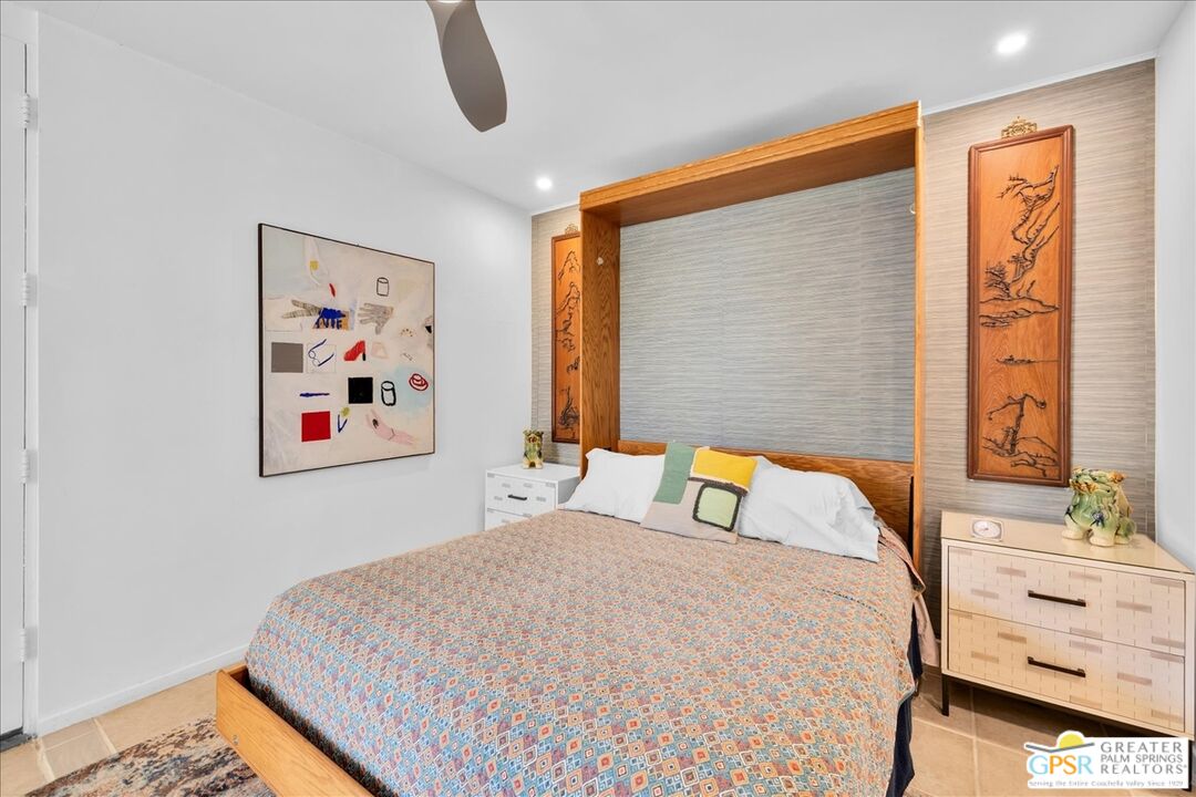 360 Cabrillo Road, Unit 220 Palm Springs, CA 92262 - Photo 26 of 57 a bedroom with a bed and a painting on the wall