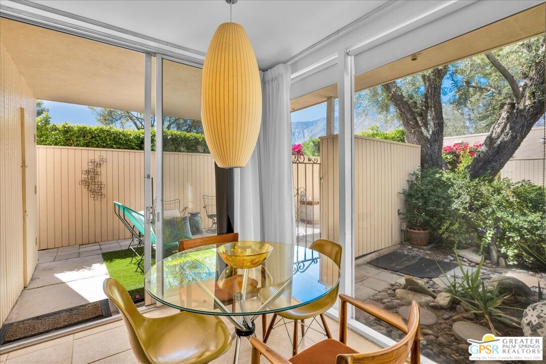 360 Cabrillo Road, Unit 220 Palm Springs, CA 92262 - Photo 29 of 57 a view of an outdoor dining space with furniture