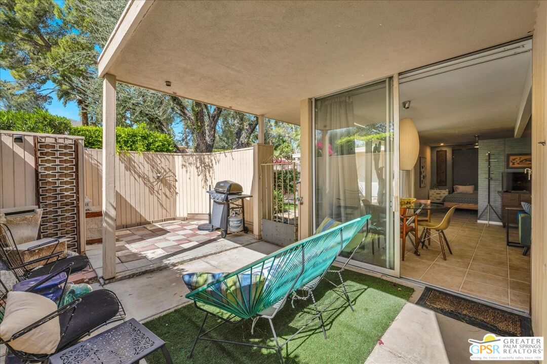 360 Cabrillo Road, Unit 220 Palm Springs, CA 92262 - Photo 31 of 57 a view of an outdoor dining space with a patio