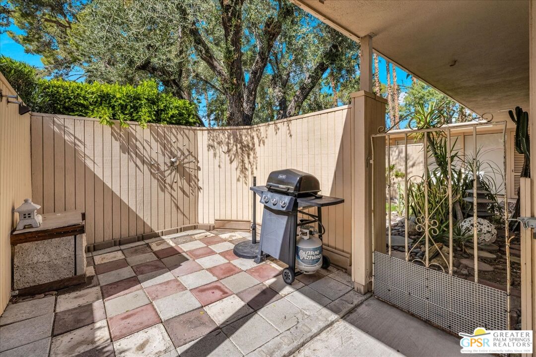 360 Cabrillo Road, Unit 220 Palm Springs, CA 92262 - Photo 34 of 57 a view of outdoor space with wooden floor and outdoor seating