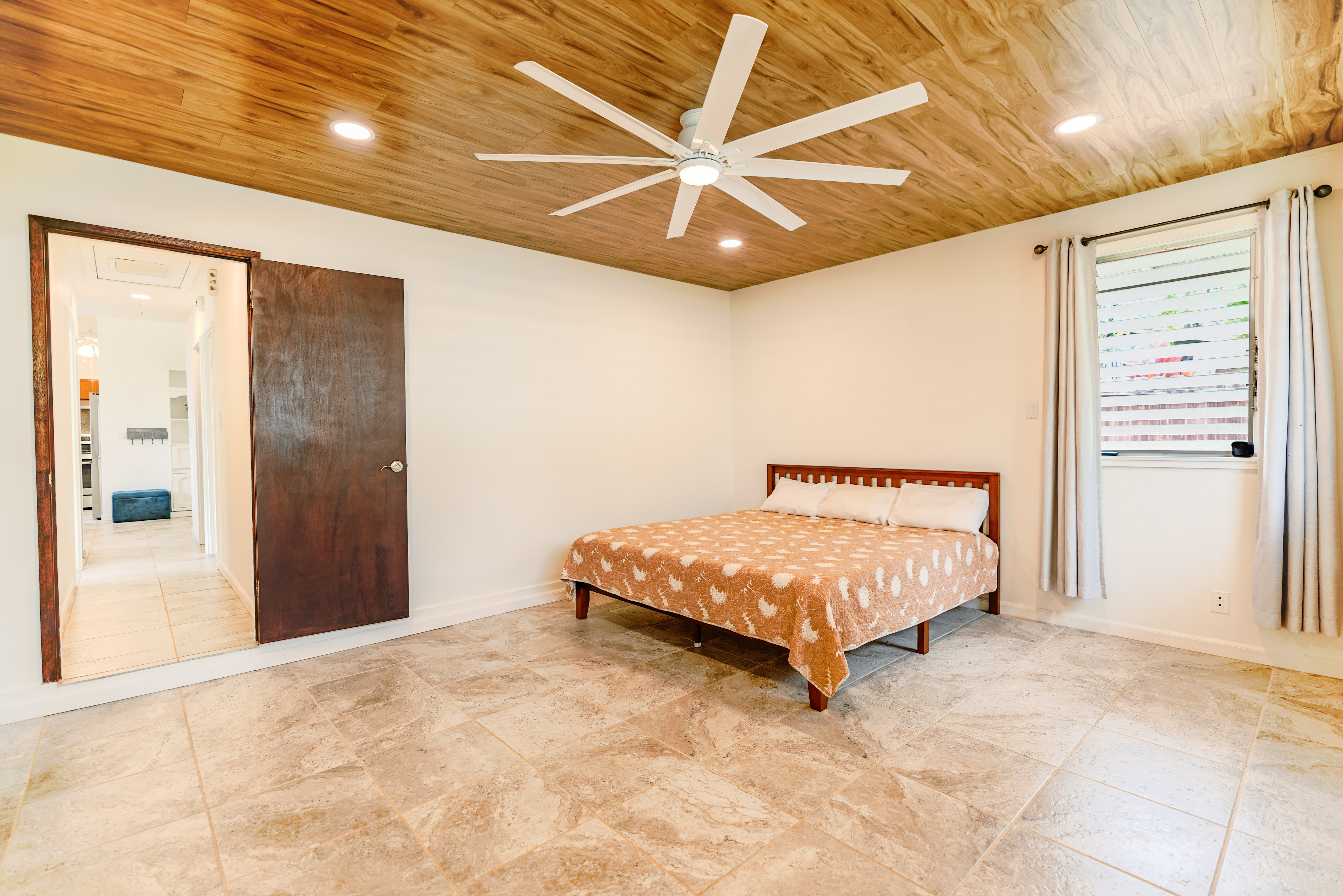 316 A Makani Road, Unit A Kapaa, HI 96746 - Photo 12 of 29 a bed sitting in a spacious bedroom next to a window