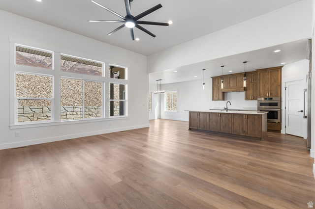 638 East Mountain Road North Ogden, UT 84414 - Photo 7 of 28 Unfurnished living room featuring dark wood-style flooring, a ceiling fan, and recessed lighting